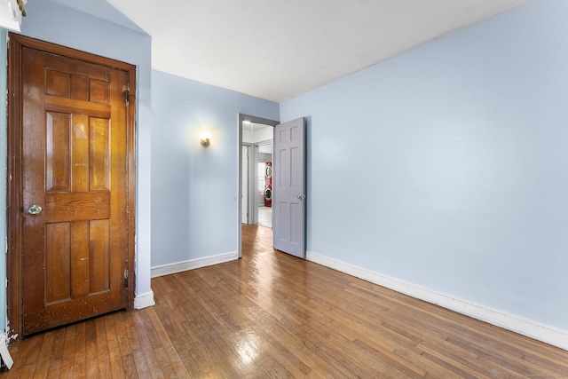 unfurnished bedroom featuring hardwood / wood-style floors