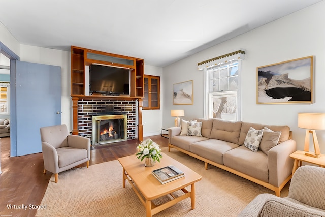 living room featuring a fireplace and wood-type flooring