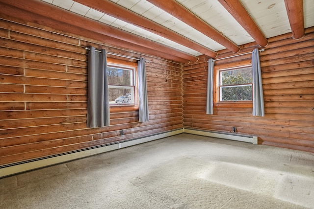 carpeted spare room featuring a baseboard heating unit and beam ceiling