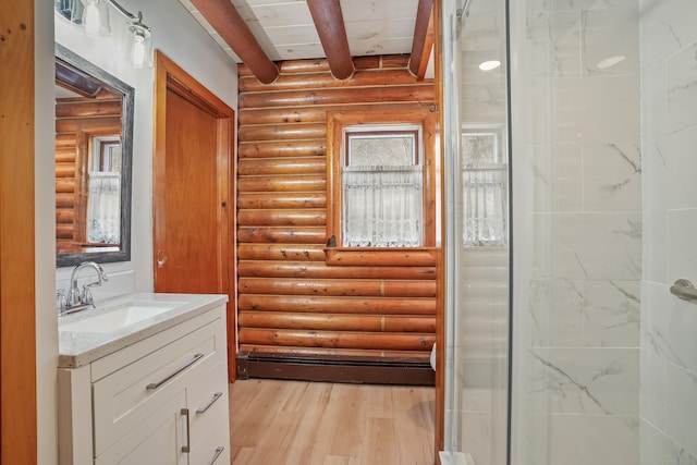 bathroom with vanity, beam ceiling, walk in shower, and hardwood / wood-style flooring