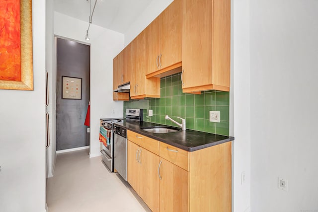 kitchen featuring sink, appliances with stainless steel finishes, and tasteful backsplash