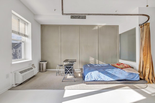 carpeted bedroom with a wall mounted air conditioner