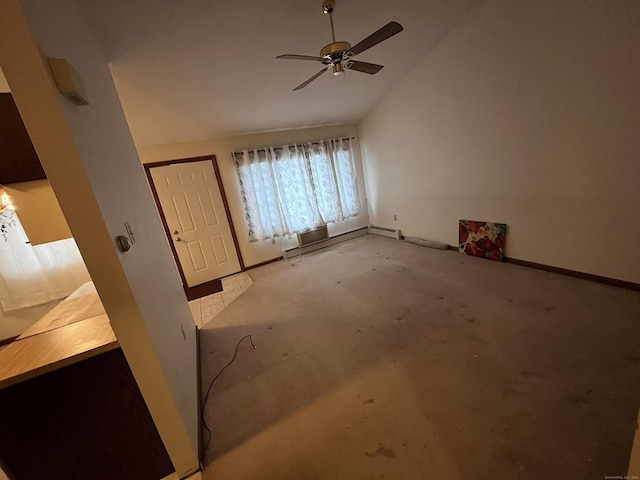 unfurnished room featuring ceiling fan and a baseboard heating unit