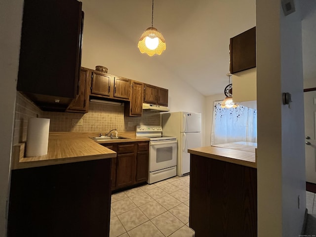 kitchen with light tile patterned floors, white appliances, hanging light fixtures, and sink