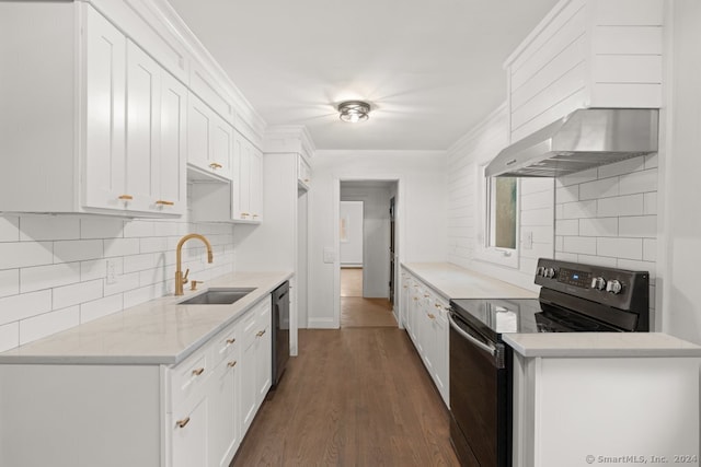 kitchen with black appliances, sink, wall chimney exhaust hood, dark hardwood / wood-style floors, and white cabinetry