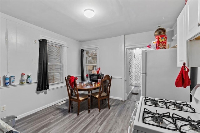 dining area with wood-type flooring