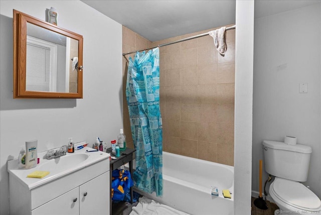 full bathroom with vanity, toilet, and shower / tub combo with curtain