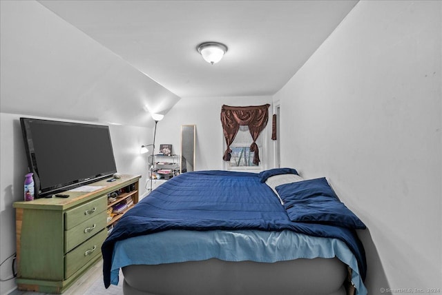 bedroom featuring lofted ceiling