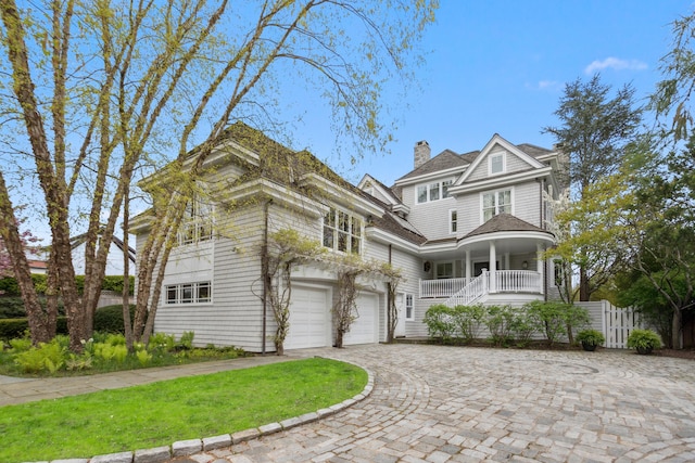 view of front of house with a garage and covered porch