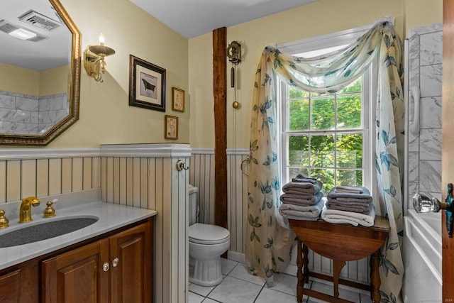 bathroom with tile patterned floors, vanity, and toilet