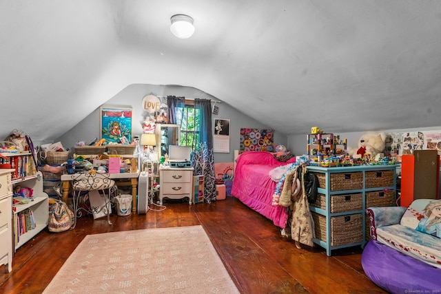 bedroom with dark hardwood / wood-style floors and vaulted ceiling