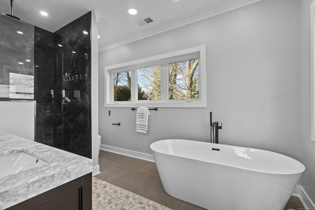 full bathroom featuring tile patterned floors, ornamental molding, vanity, independent shower and bath, and toilet