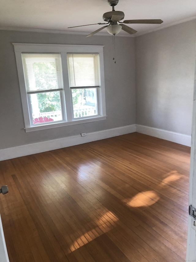 spare room with ceiling fan and hardwood / wood-style floors