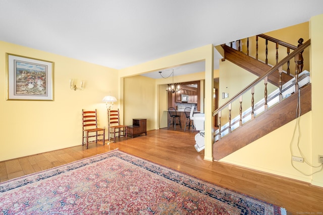 interior space with a chandelier and hardwood / wood-style flooring