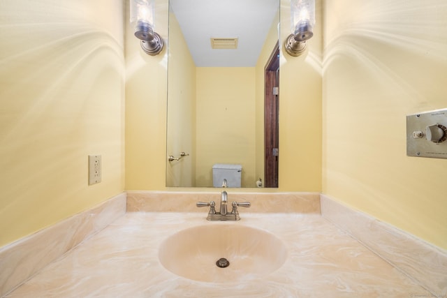 bathroom featuring sink and toilet