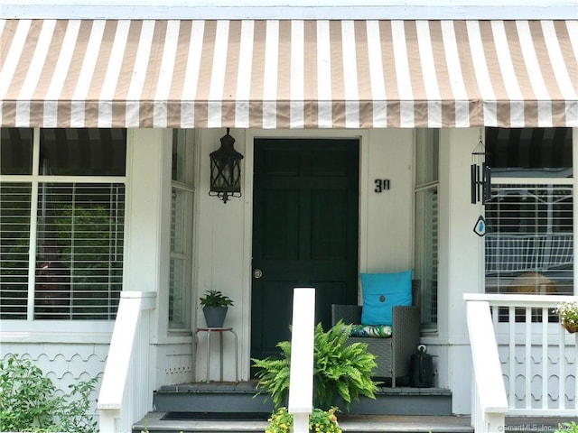 property entrance with covered porch