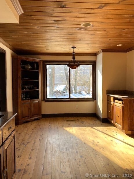 bonus room with light hardwood / wood-style floors