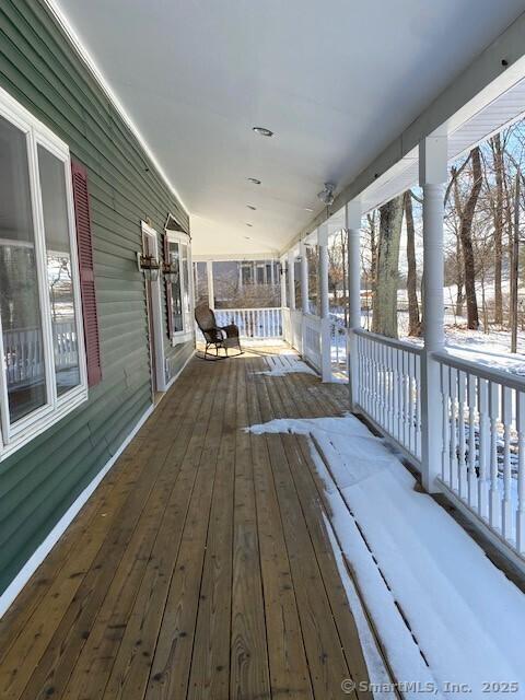 view of snow covered deck