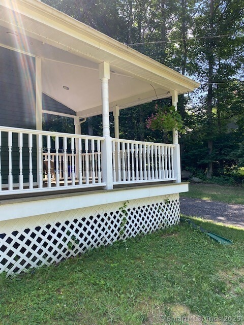 276 Parker Farms Rd, Wallingford, CT 06492 - view of property exterior featuring a porch and a lawn