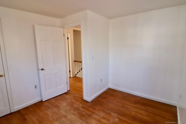 spare room featuring hardwood / wood-style floors