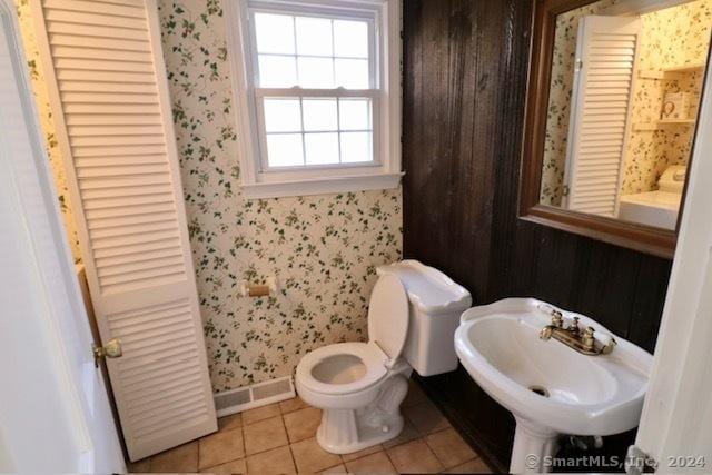 bathroom with tile patterned floors, sink, and toilet