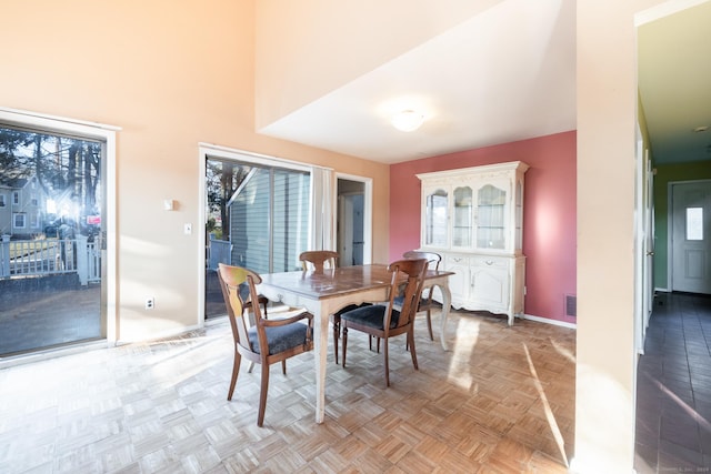 dining room with light parquet floors