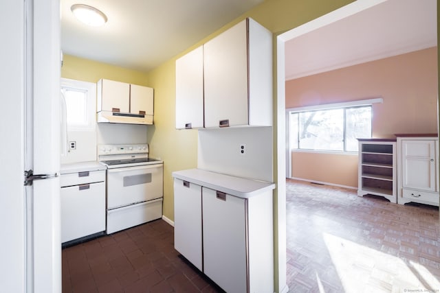 kitchen featuring white cabinets and white appliances