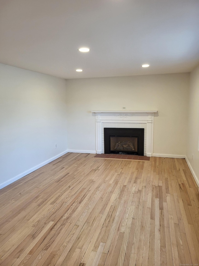 unfurnished living room with light hardwood / wood-style flooring