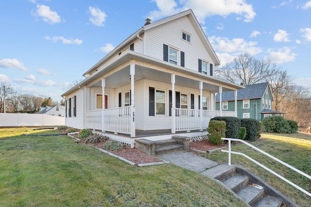 farmhouse-style home with covered porch and a front lawn