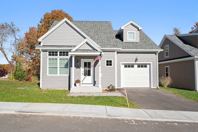 view of front facade featuring a garage and a front lawn