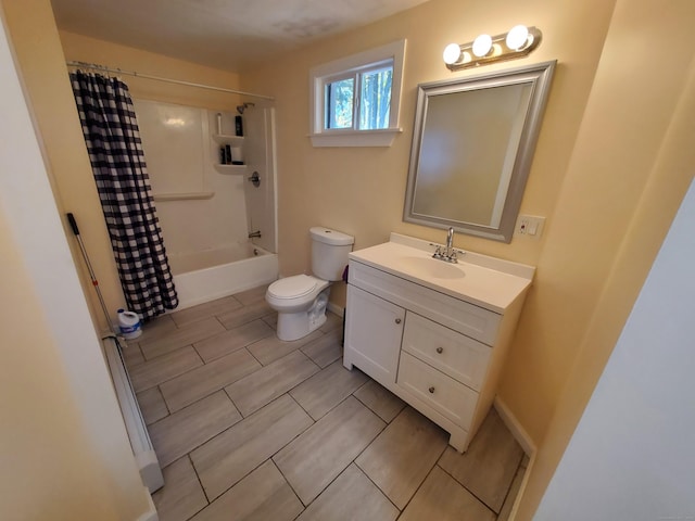 full bathroom featuring vanity, toilet, and shower / tub combo with curtain