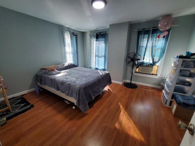 bedroom featuring hardwood / wood-style flooring, cooling unit, and billiards