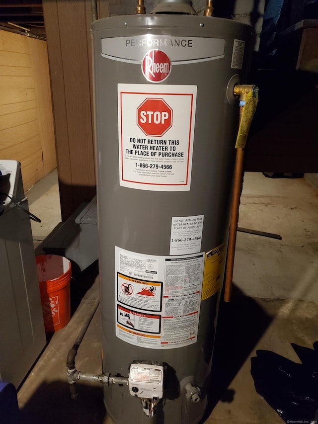 utility room with water heater