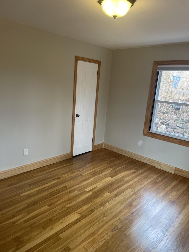 empty room featuring hardwood / wood-style flooring