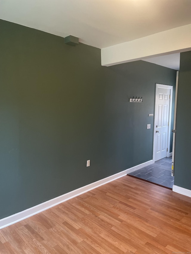 empty room with hardwood / wood-style floors