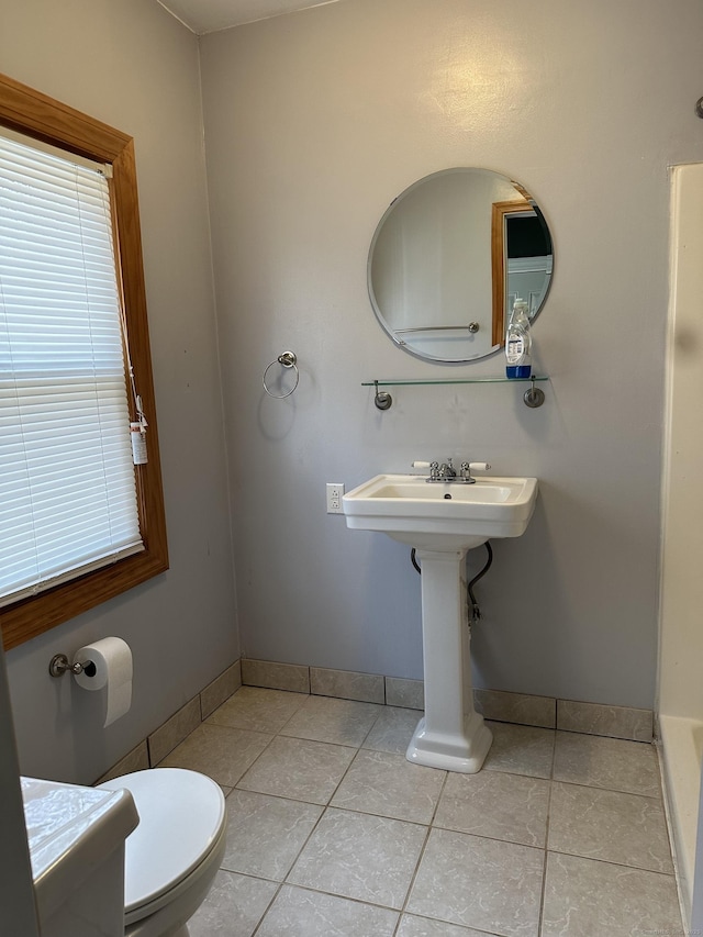 bathroom with tile patterned flooring and toilet