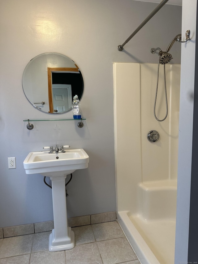 bathroom featuring a shower and tile patterned floors