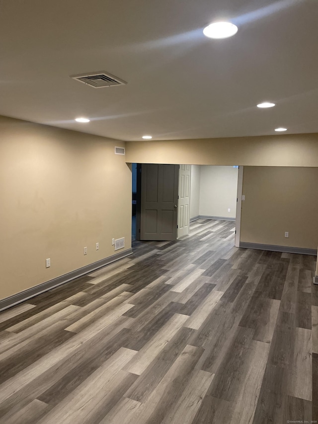 basement featuring dark hardwood / wood-style floors