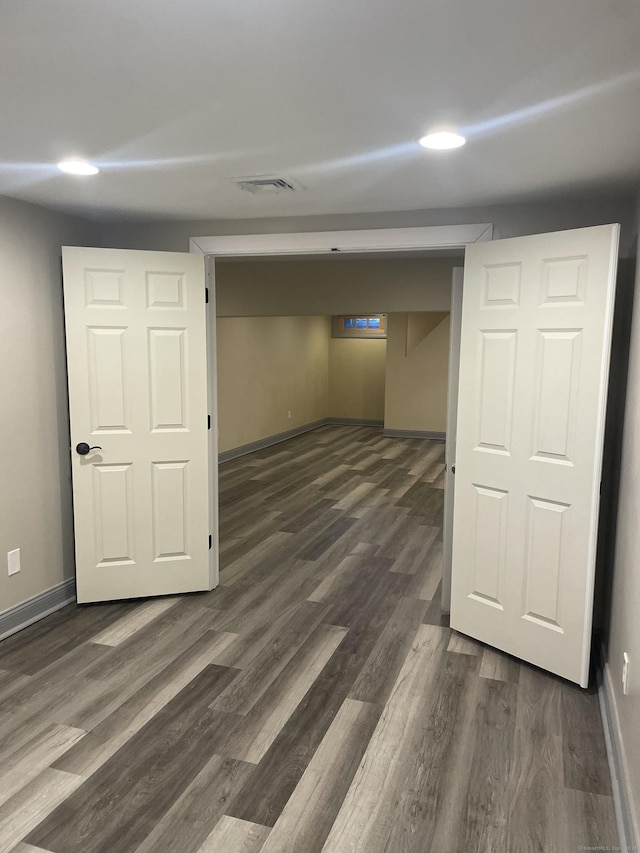 basement with dark wood-type flooring