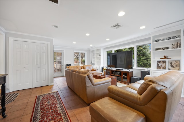 living room with built in shelves, light tile patterned floors, and ornamental molding