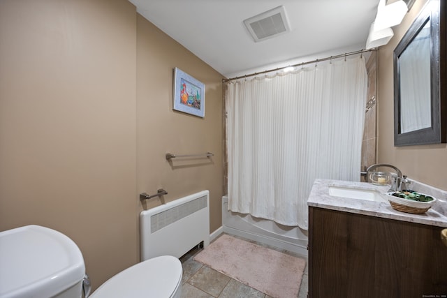 full bathroom featuring radiator, tile patterned floors, shower / bath combination with curtain, toilet, and vanity