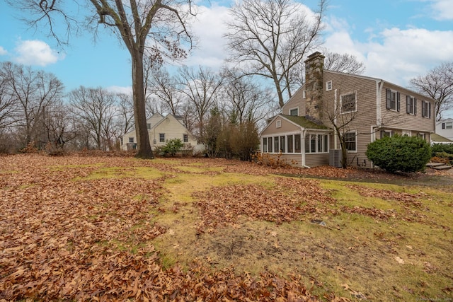 view of yard with a sunroom