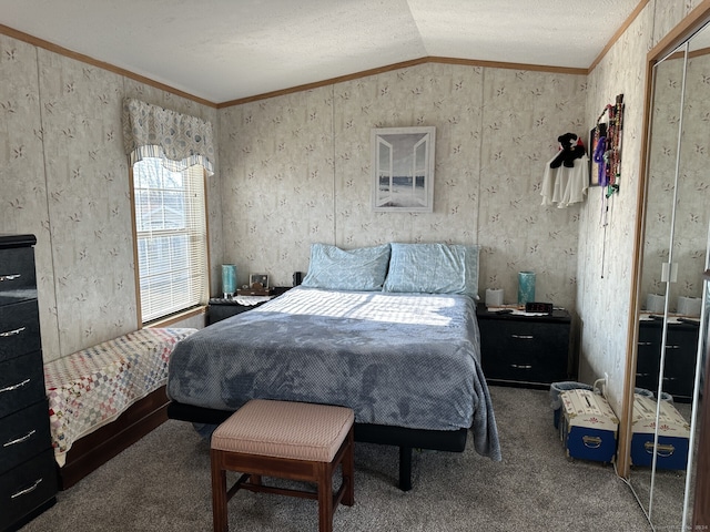 bedroom with ornamental molding, vaulted ceiling, and carpet