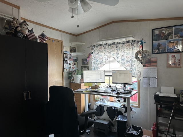 office area with a textured ceiling, ceiling fan, ornamental molding, and vaulted ceiling