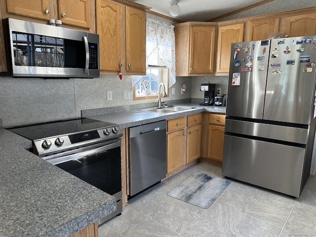 kitchen featuring sink, decorative backsplash, and appliances with stainless steel finishes