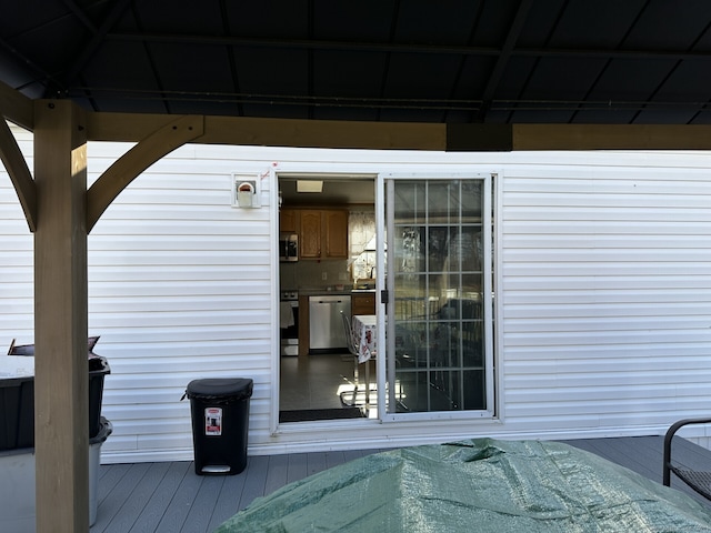 doorway to property featuring a deck