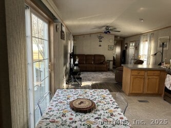 dining room with lofted ceiling and ceiling fan