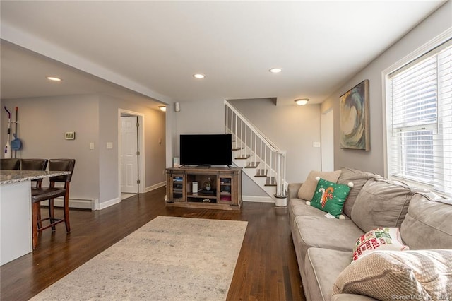 living room with dark wood-type flooring, recessed lighting, stairway, and baseboards