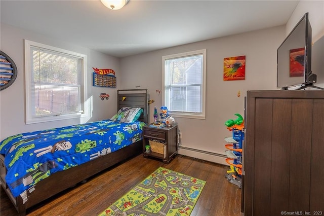 bedroom featuring a baseboard radiator and wood-type flooring