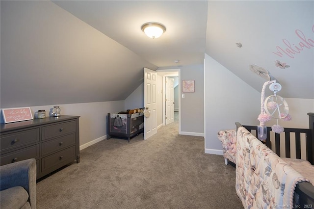 bedroom featuring lofted ceiling, baseboards, and carpet flooring